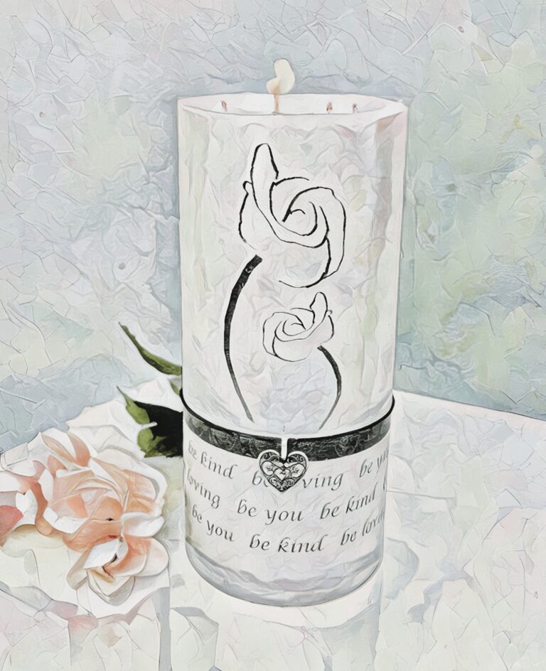 An image of a white candle with a flower outline and heart charm. Free download.
