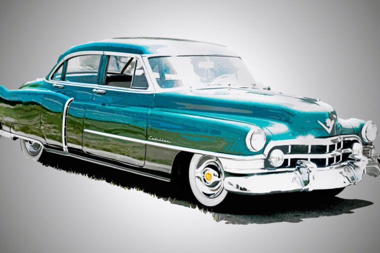 A vintage turquoise Cadillac car with chrome details,. Free download.